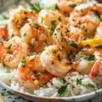 Top view of creamy garlic butter shrimp served over fluffy white rice