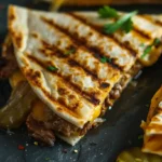 Grilled Smashburger Quesadillas stacked with pickles and melted cheese