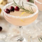 Holiday lemon drop cocktail with cranberries and rosemary