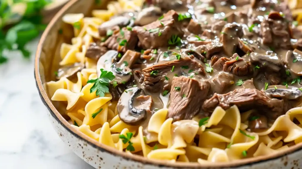 Leftover Prime Rib Stroganoff in a bowl with fresh herbs