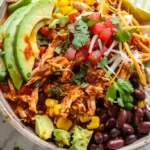 Chicken Burrito Bowl with shredded chicken, avocado, black beans, and rice