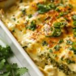 Cheesy Healthy Salsa Verde Chicken Casserole in white baking dish