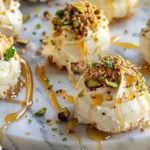 Ricotta Pistachio Honey Bites elegantly plated with honey and mint