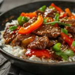 Slow Cooker Pepper Steak Recipe bowl with rice