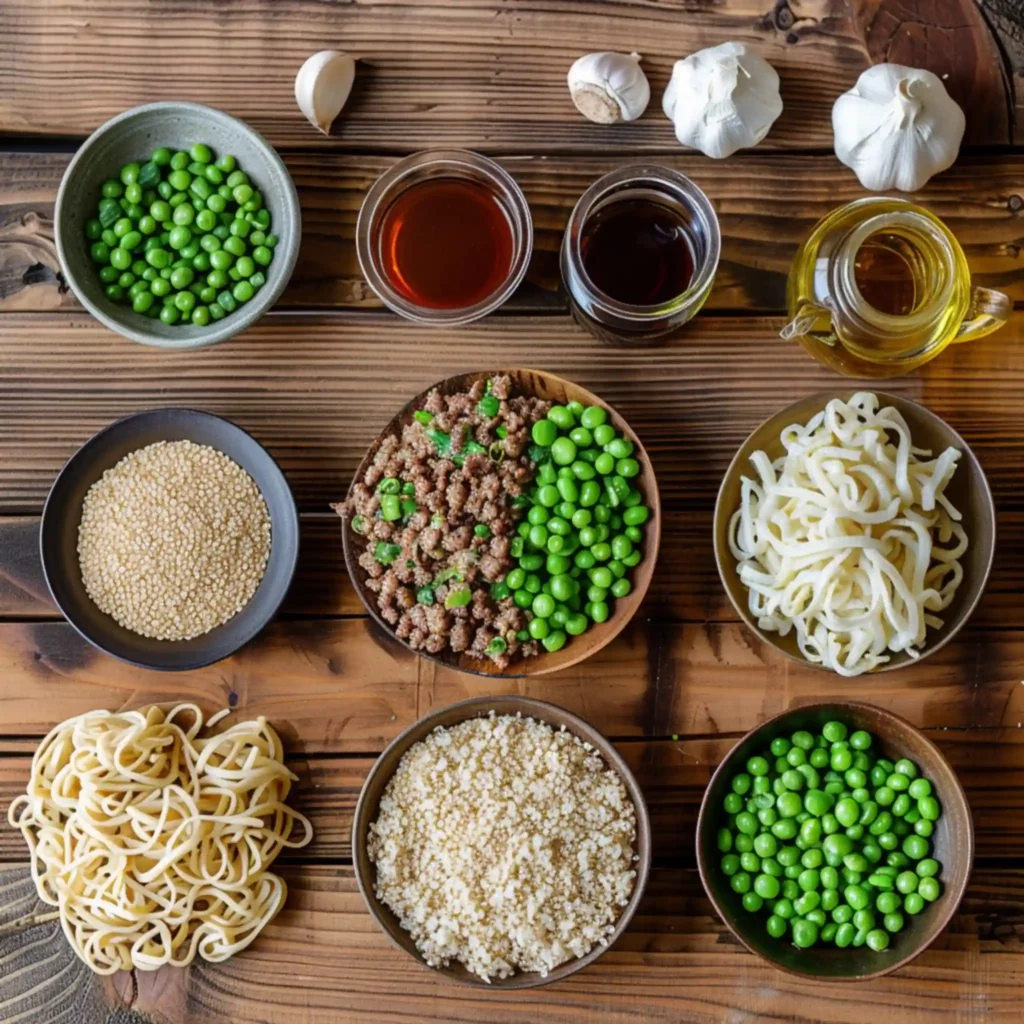 Ingredients for Korean beef noodles including meat, peas, and sauces
