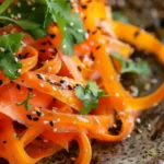 Shaved Rainbow Carrot Sesame Salad with sesame seeds